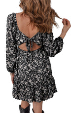 LuckeLadybug black floral mini dress with long puff sleeves open back tie and ruffle hem styled with boots