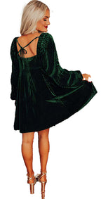 LuckeLadybug holiday display showing model in green velvet mini dress similar to black velvet babydoll dress