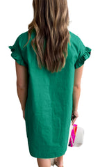 Back view of model in LuckeLadybug bright green ruffle sleeve dress H Line knee length shift style