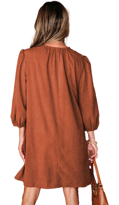 LuckeLadybug brown corduroy mini dress for women back view with puff sleeves and leather bag