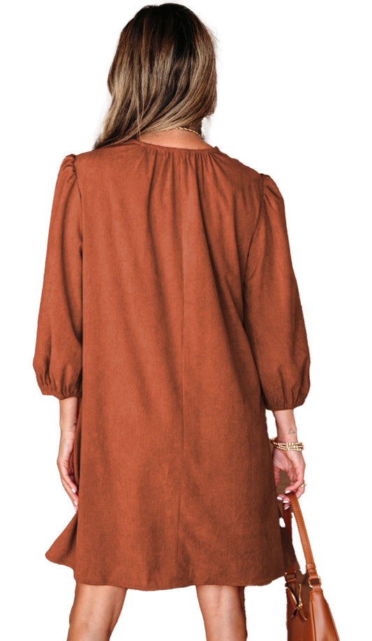 LuckeLadybug brown corduroy mini dress for women back view with puff sleeves and leather bag