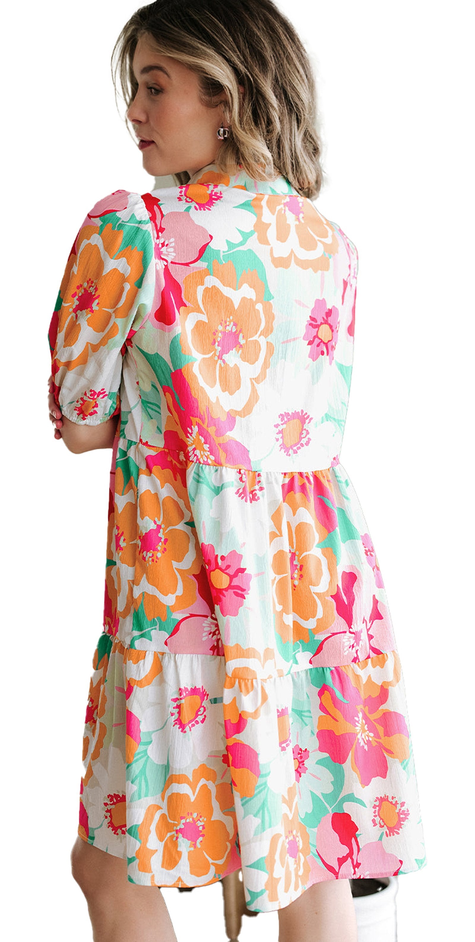 Back view of woman wearing LuckeLadybug green floral babydoll dress A line tiered skirt and puff sleeves