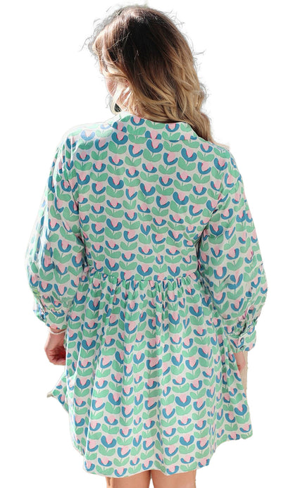 LuckeLadybug green floral print mini dress back view with puff sleeves smocked waist and tiered skirt