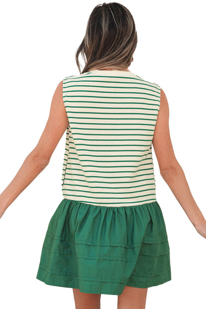 Back view of model wearing green stripe ruffle mini dress with sleeveless striped top and green ruffle skirt
