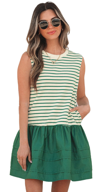 Model wearing green stripe ruffle mini dress sleeveless with tiered skirt and side pocket casual summer outfit
