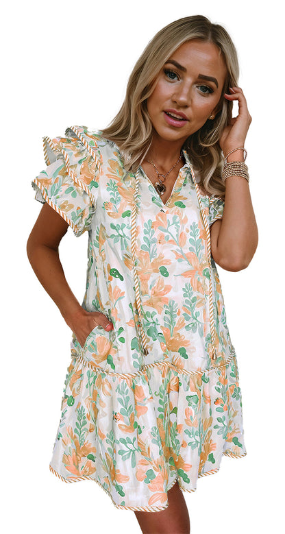 Dear Lover Dropshipping sky blue floral mini dress listing shown in pastel peach and green floral print on model