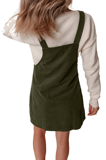 LuckeLadybug back view vineyard green corduroy overall dress over cream sweater mini length adjustable straps