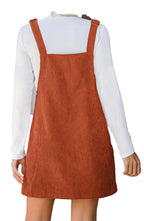 Back view of LuckeLadybug mini corduroy overall dress with adjustable straps over white tee vineyard green corduroy overall dress