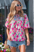 Bright floral short sleeve women blouse by LuckeLadybug LLC, perfect for casual summer outings