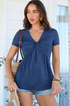 Navy short sleeve women blouse with a twisted front design and relaxed fit for casual wear