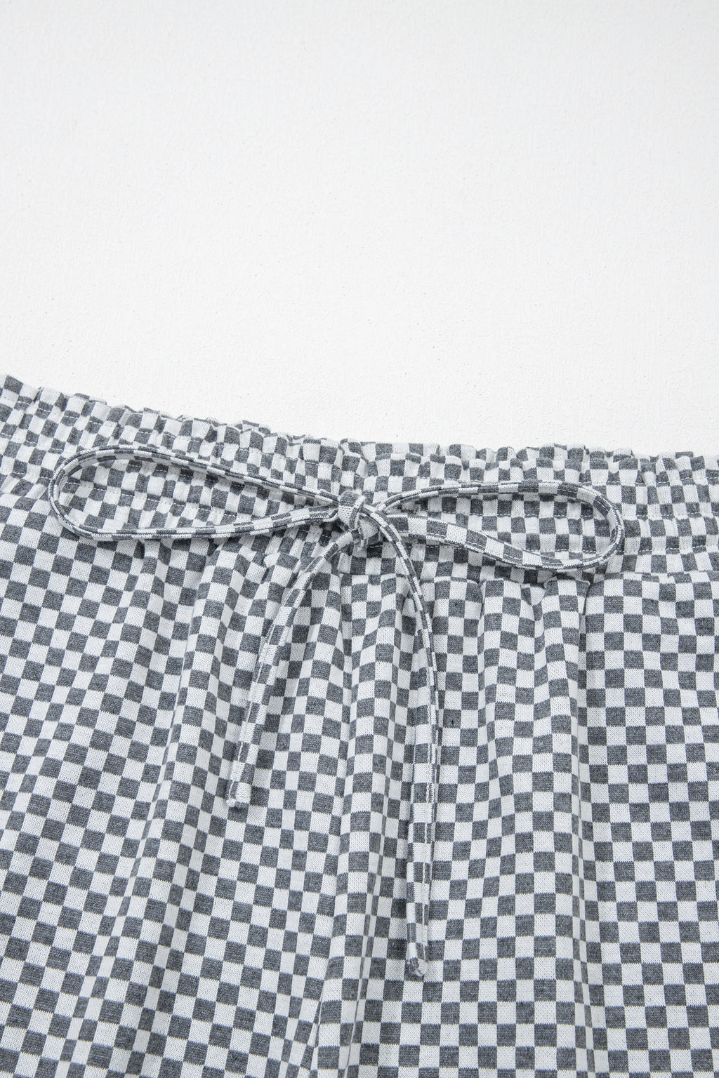Gray and white checkered drawstring shorts from LuckeLAdybug LLC for comfortable casual wear