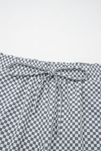Gray and white checkered drawstring shorts from LuckeLAdybug LLC for comfortable casual wear