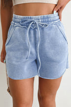 Light blue drawstring shorts with pockets, perfect for casual summer outings