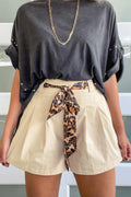 Beige shorts with animal print belt from LuckeLadybug LLC, stylish and versatile for casual wear
