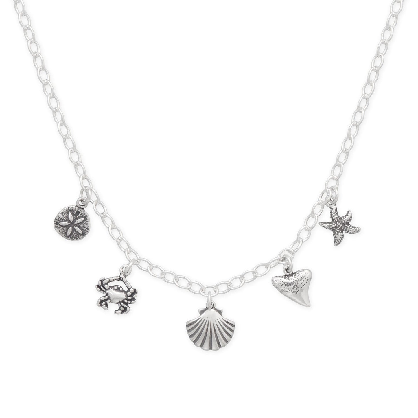 Silver seaside charm necklace featuring a crab, starfish, seashell, and sand dollar charms