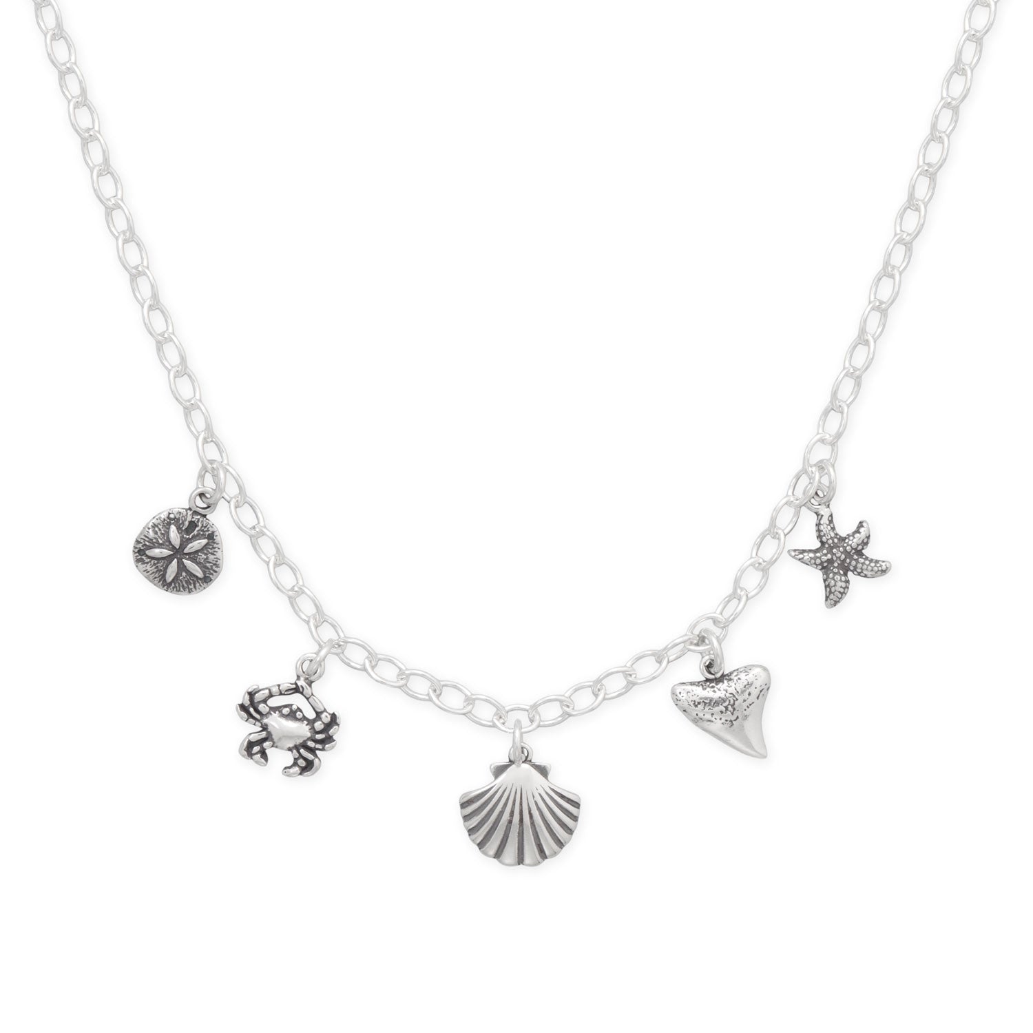 Silver seaside charm necklace featuring a crab, starfish, seashell, and sand dollar charms
