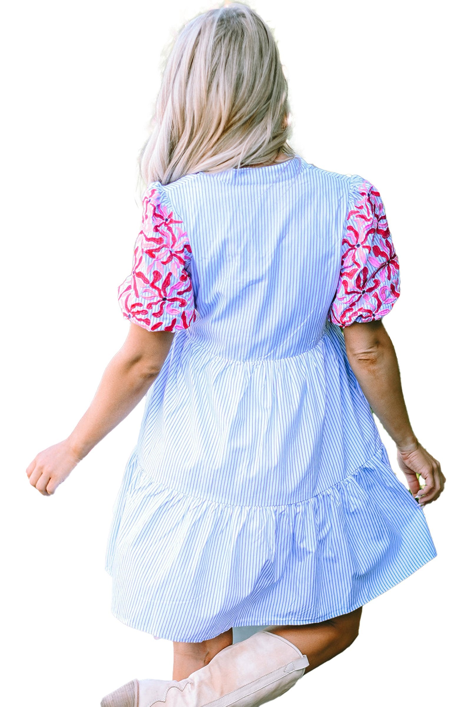 Back view of a sky blue striped floral dress with colorful puff sleeves for a casual summer look