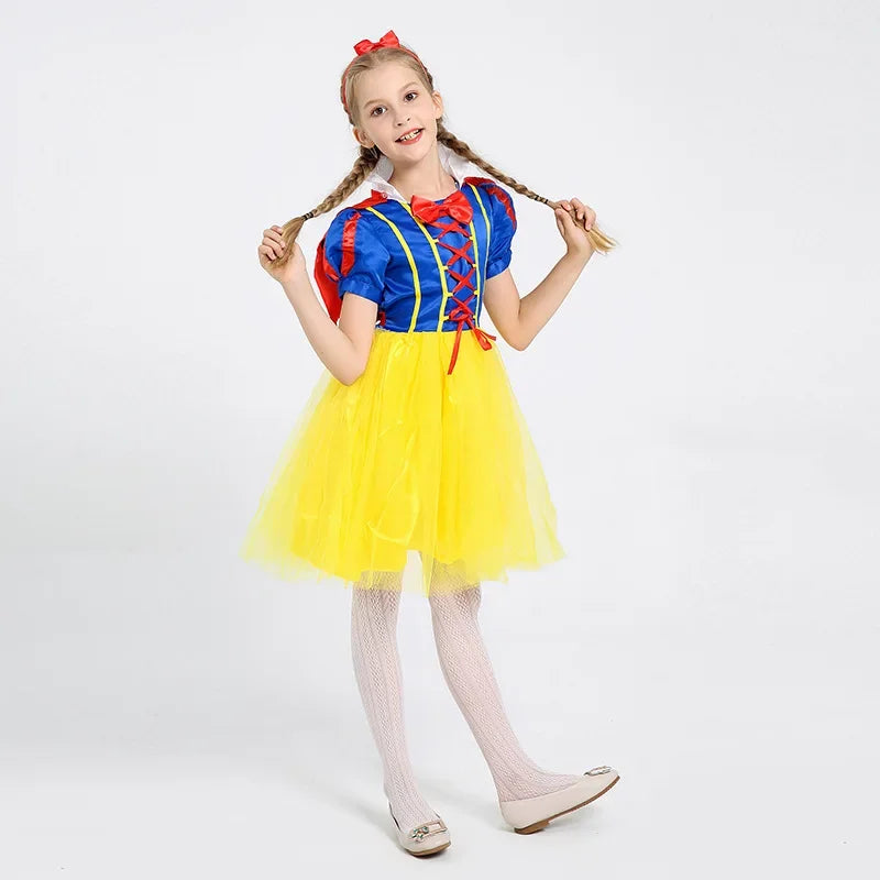 Cute girl wearing a vibrant Snow White princess costume for girls with a yellow tulle skirt and blue top
