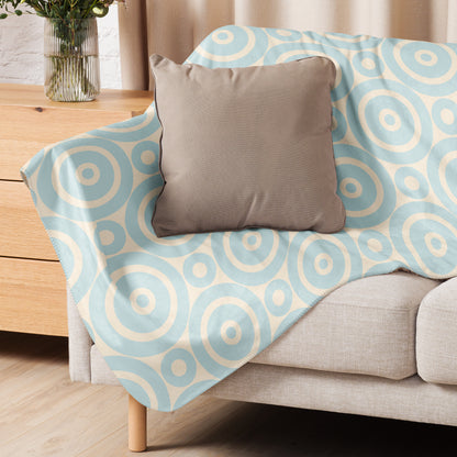 LuckeLadybug Sherpa Blanket with soft circle design throw blanket pattern draped over beige sofa with gray pillow