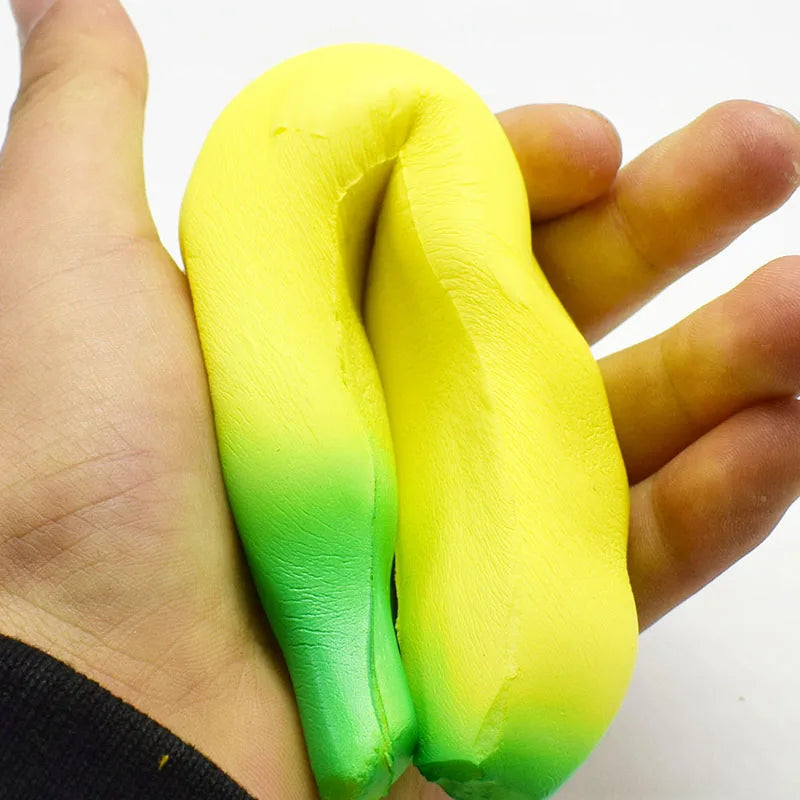 Yellow and green squishy toy in hand, perfect for stress relief and fun play