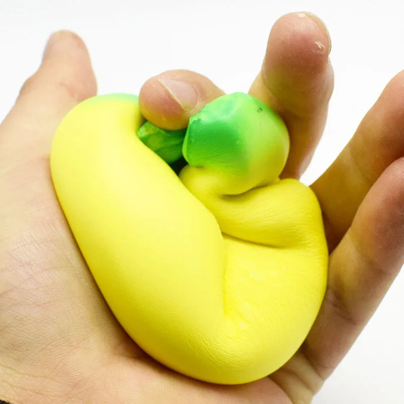 LuckeLadybug squishy toy in yellow and green being squeezed in hand for stress relief