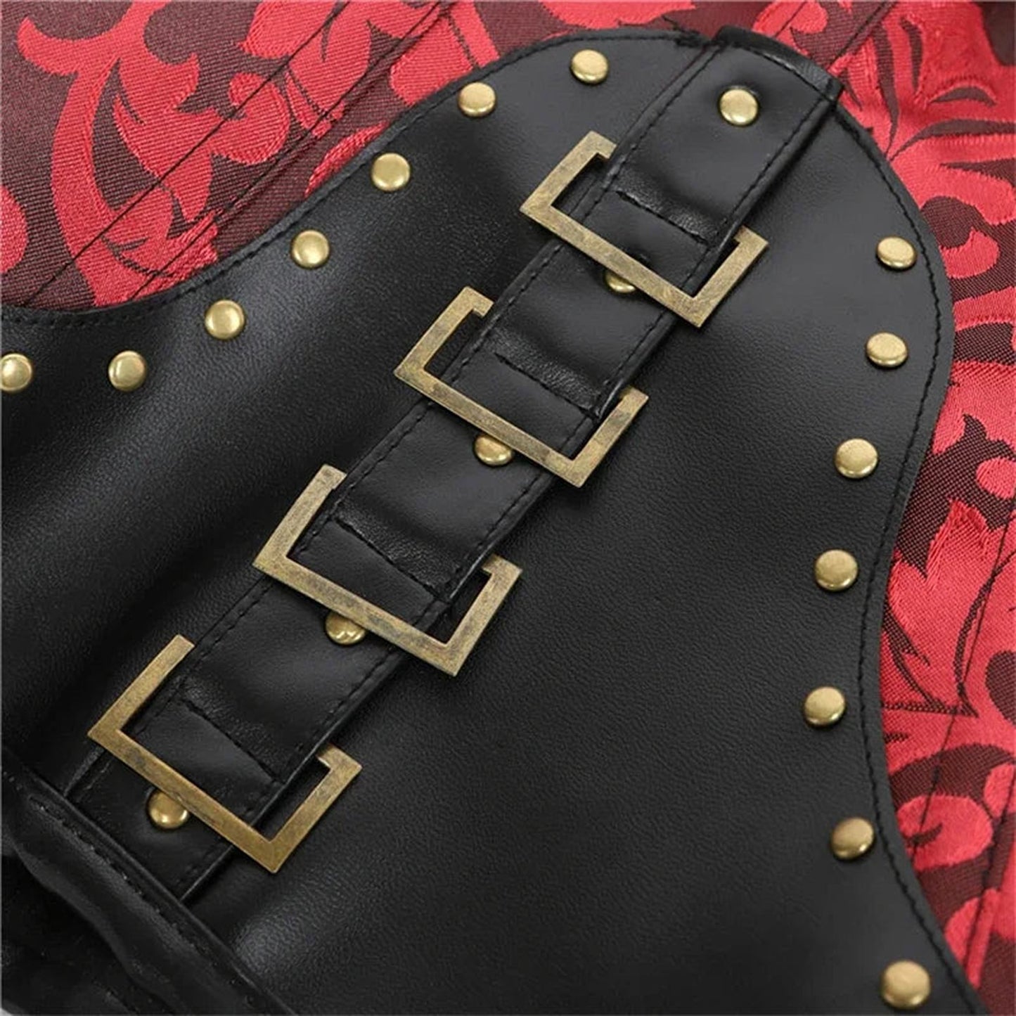 Close-up of a steampunk corset top for women featuring black leather and decorative studs