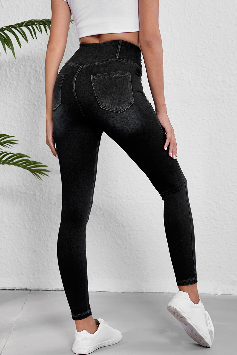 Black stretchy jeggings from LuckeLAdybug LLC with high-waisted design and a fitted silhouette