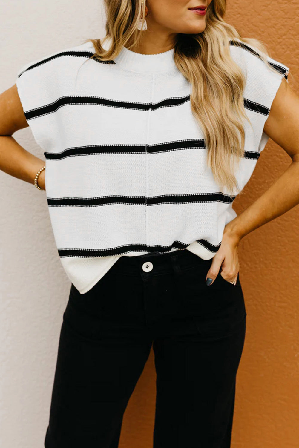 LuckeLadybug striped sweater vest featuring black and white stripes for a stylish casual look