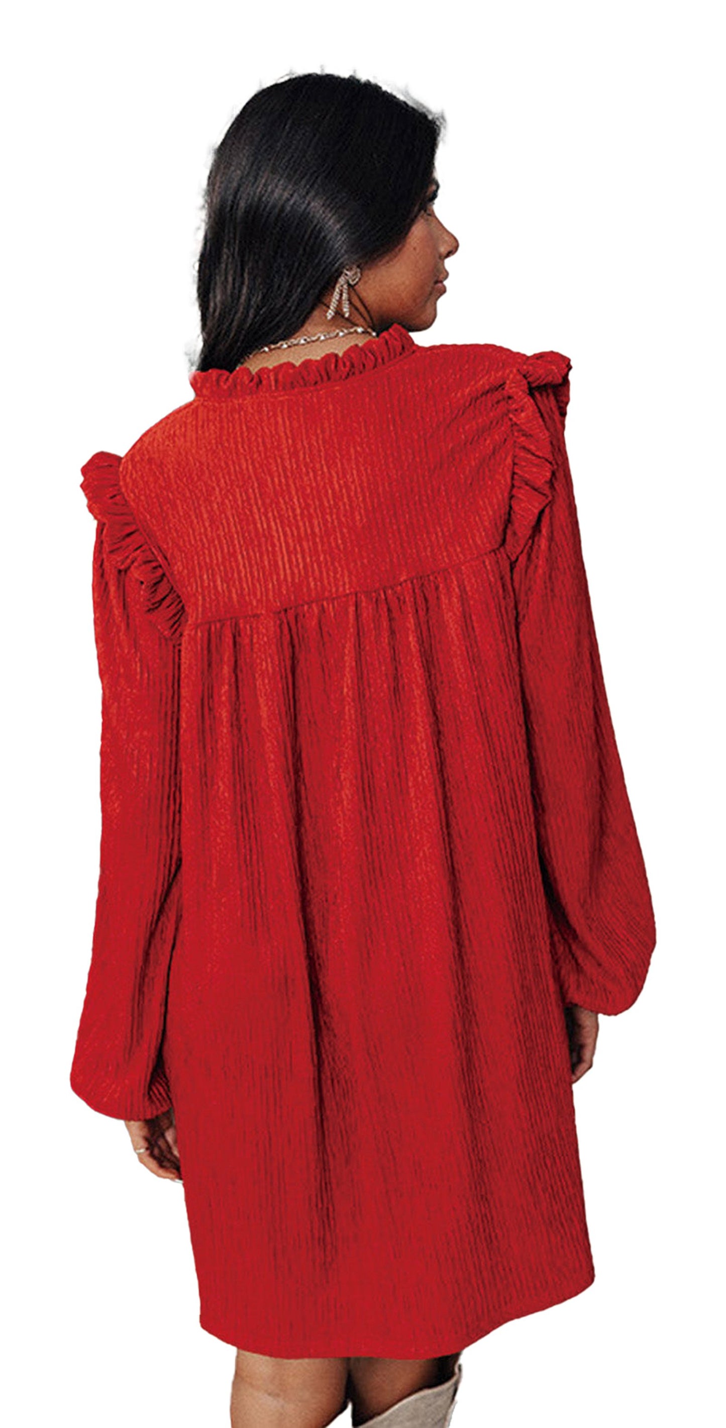 Woman wearing LuckeLadybug fiery red ruffled mini dress back view with long sleeves and ruffle yoke near Christmas tree