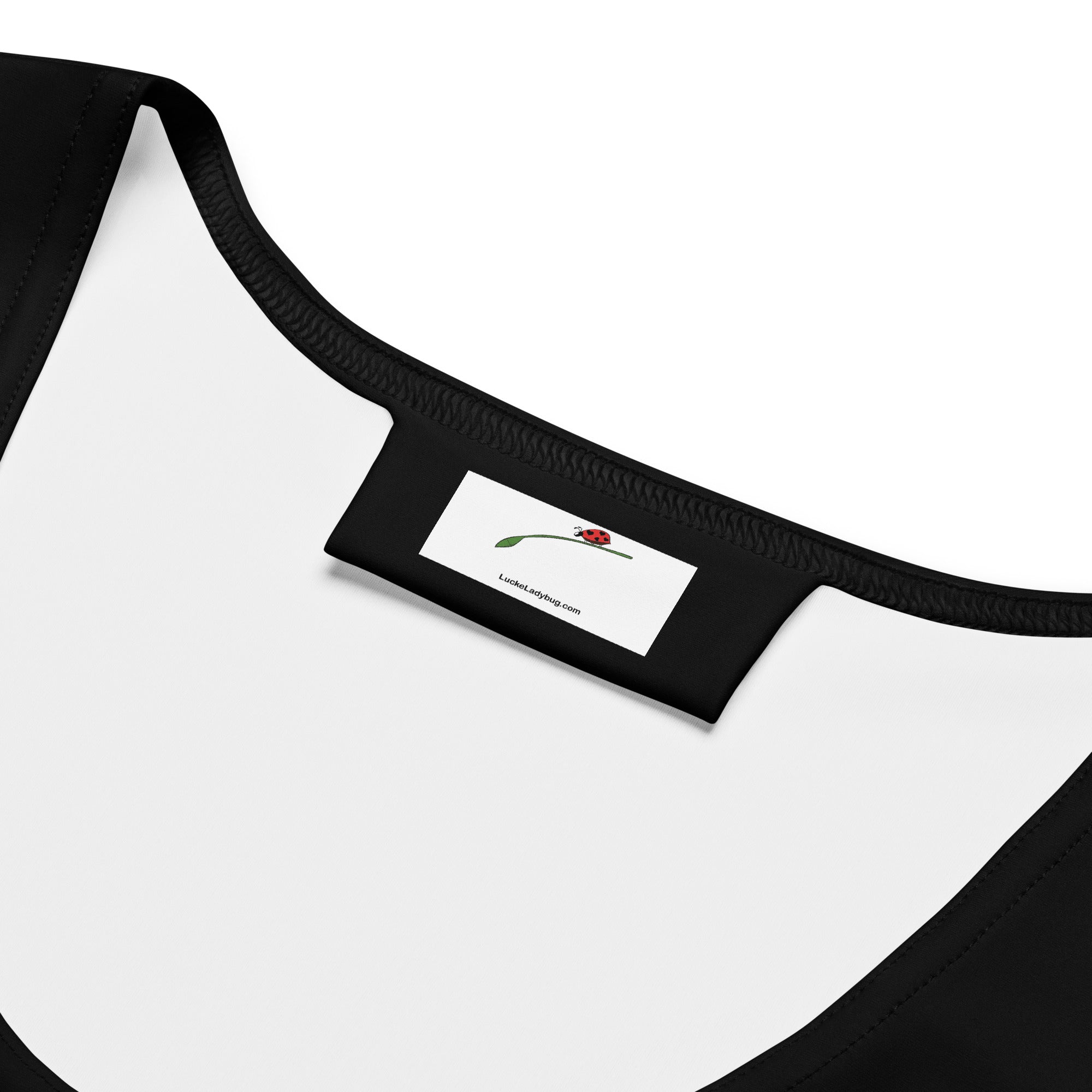 Close-up of neckline and label on a stylish bodycon dress for women by LuckeLadybug