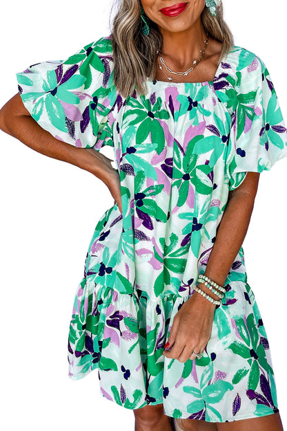 Model wearing LuckeLadybug green floral mini dress with puff sleeves ruffle hem square neckline casual summer style