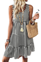 LuckeLadybug black striped mini dress sleeveless tiered summer dress worn with straw bag beaded necklace