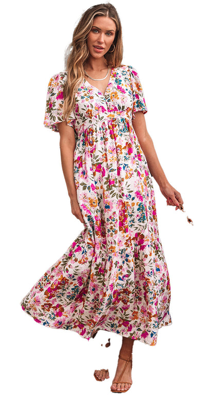 LuckeLadybug model wearing red floral maxi dress with V neck short sleeves tiered skirt and straw bag