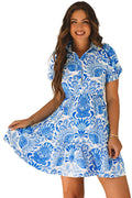LuckeLadybug model wearing sky blue floral mini dress with short sleeves and tiered skirt