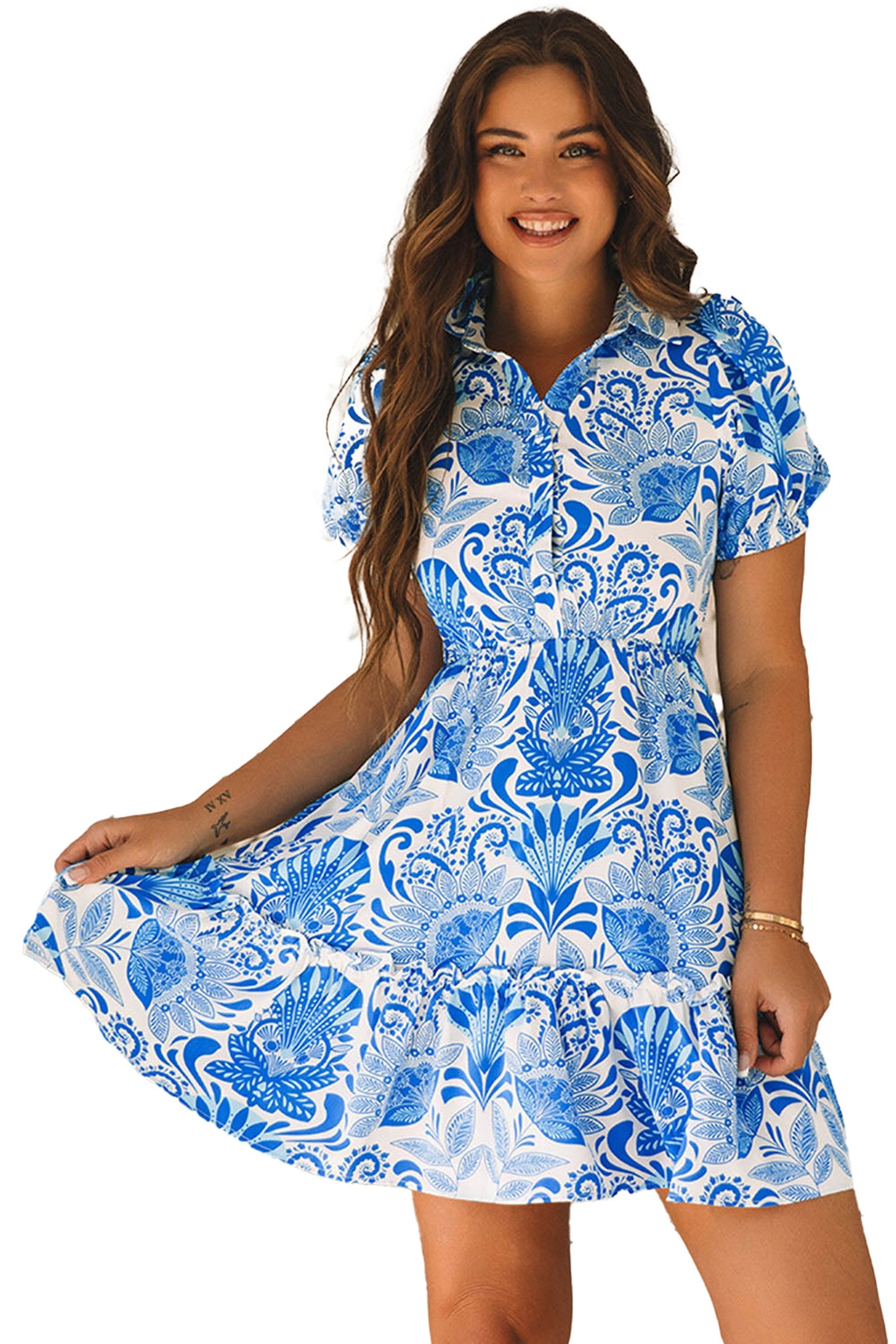 LuckeLadybug model wearing sky blue floral mini dress with short sleeves and tiered skirt