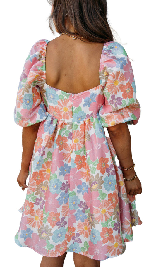 LuckeLadybug pink floral babydoll dress back view with low square back puff sleeves above knee