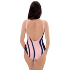 Back view of model in LuckeLadybug pink and navy striped elegant one-piece swimsuit for women with low scoop back