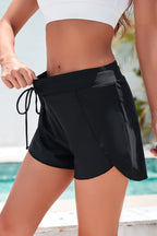 Black swim shorts men with a drawstring waistband for a comfortable fit and stylish summer wear