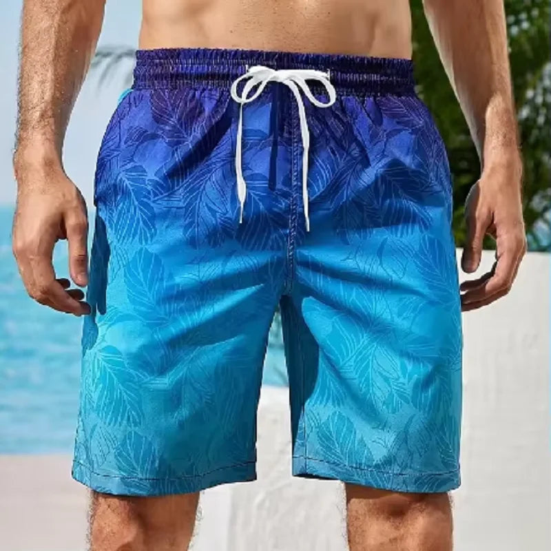 LuckeLadybug men's swim shorts in blue with a leaf pattern, perfect for beachwear and summer activities