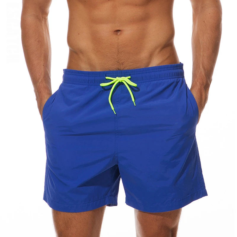 LuckeLadybug swim shorts men in blue with neon drawstring and side pockets for beach activities