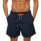 Navy LuckeLadybug swim shorts men with contrast orange drawstring for beachwear