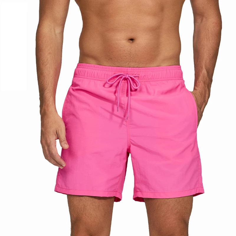 LuckeLadybug men's swim shorts in bright pink with a comfortable elastic waistband