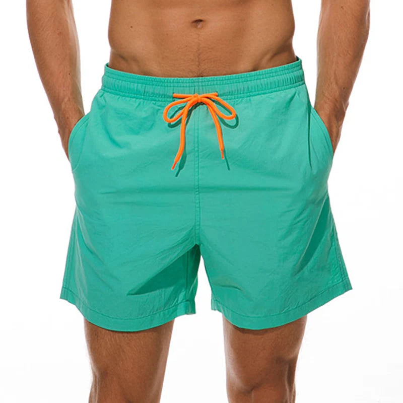 LuckeLadybug LLC Men's Swim Shorts in Bright Green with Orange Drawstring and Pockets