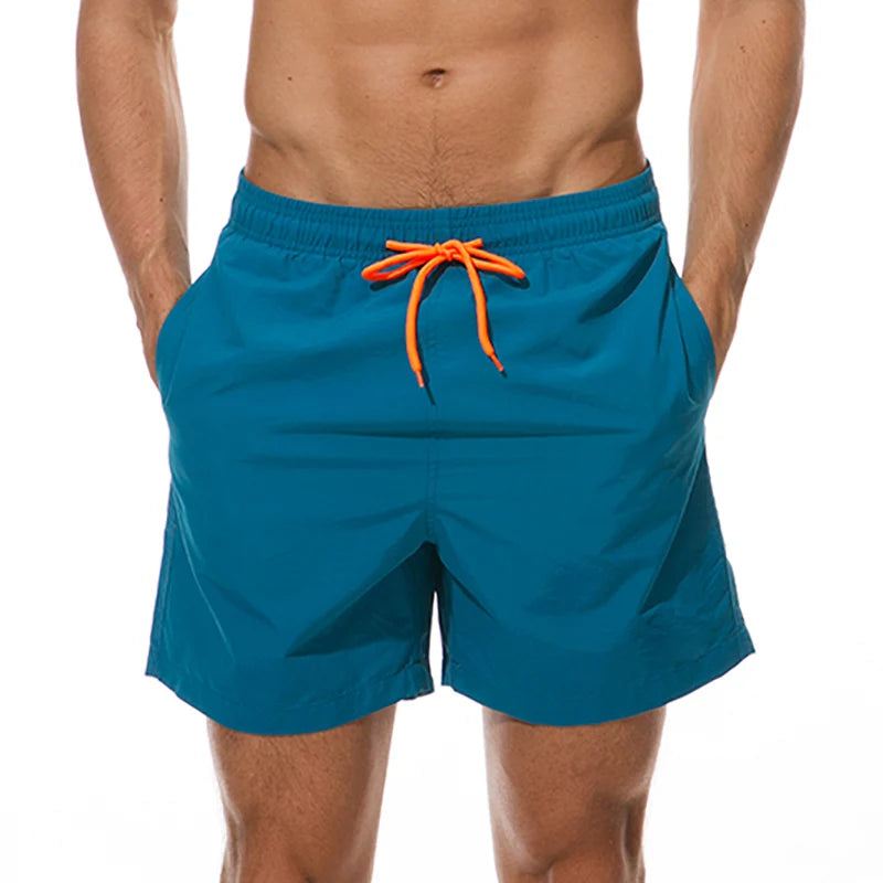 LuckeLadybug men's swim shorts in teal with orange drawstring and side pockets