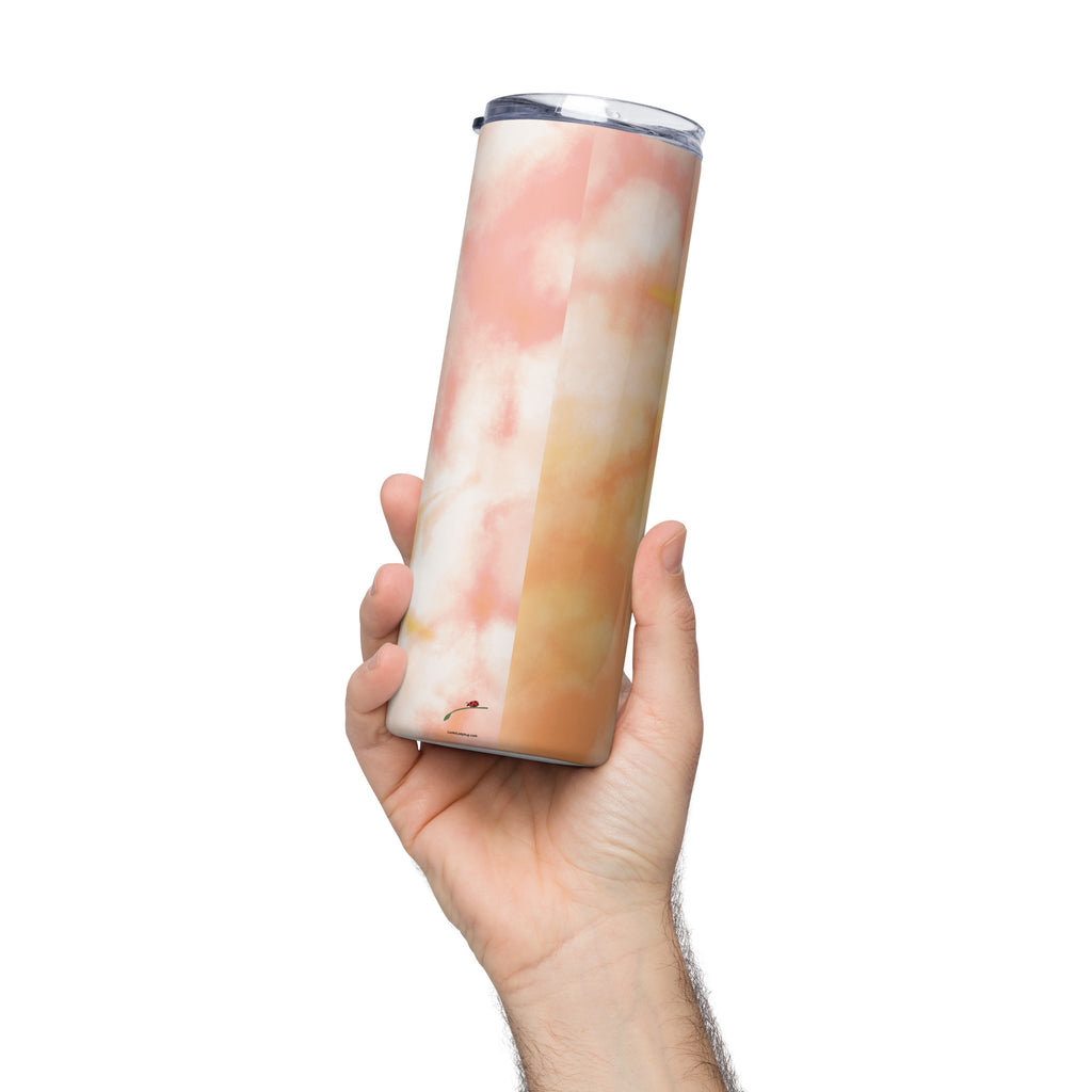 Hand holding a LuckeLadybug tie dye stainless steel tumbler with pink and orange gradient design