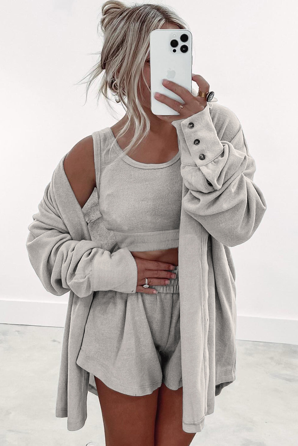 Women's beige lounge shorts paired with a cozy top tank tops and cardigan for a relaxed look