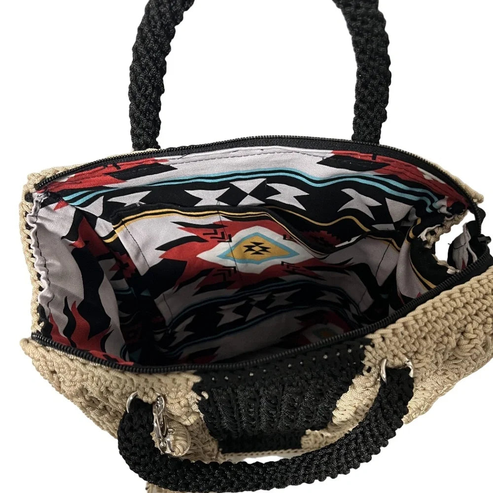 Inside view of ThreadsByHannah tote bag featuring a vibrant patterned lining and braided handles