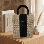 Stylish ThreadsByHannah tote bag made of woven fabric with a black and beige design.