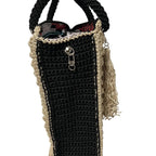Black and beige woven tote bag with tassel and zipper detail for stylish everyday use