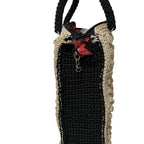 Handcrafted black and beige crocheted tote bag with a zipper and sturdy handles
